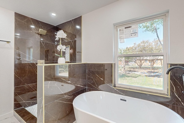 2909 Materhorn Dr, Dallas, TX 75228 - full bathroom with a soaking tub, a sink, a walk in shower, and tile walls