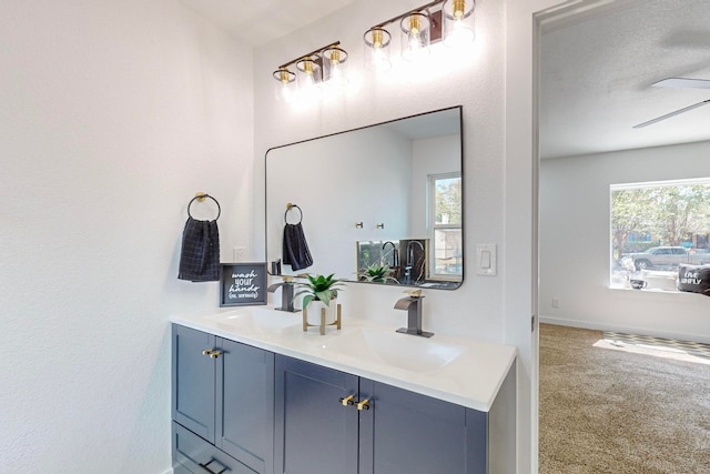 bathroom with vanity and a textured ceiling