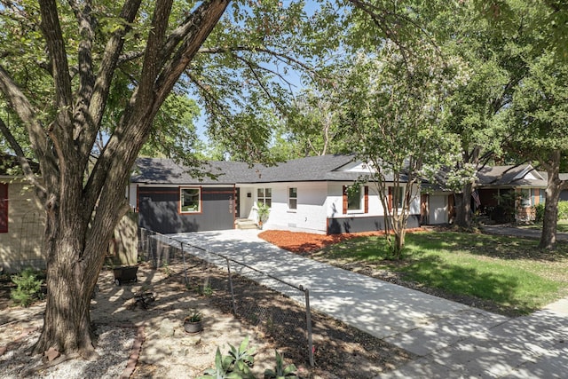 2909 Materhorn Dr, Dallas, TX 75228 - single story home with concrete driveway, a front lawn, roof with shingles, and crawl space
