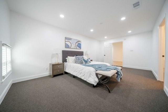 bedroom featuring dark colored carpet