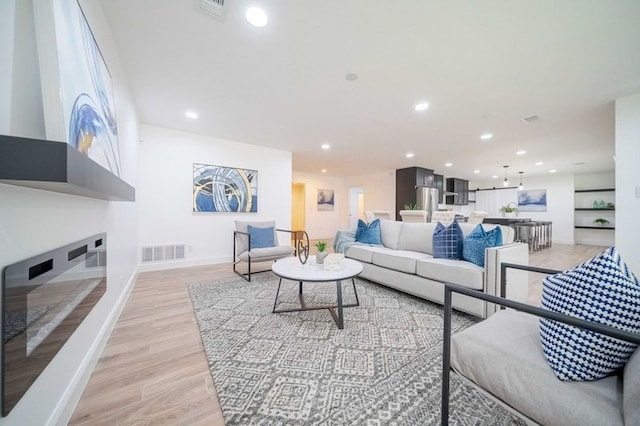 living room with light hardwood / wood-style flooring