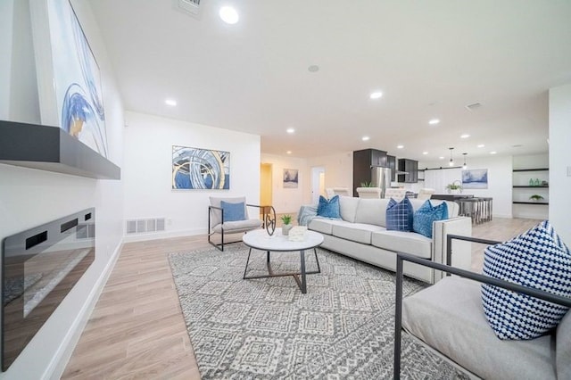 4944 Vega Ct W, Fort Worth, TX 76133 - living room with baseboards, recessed lighting, and light wood-style flooring