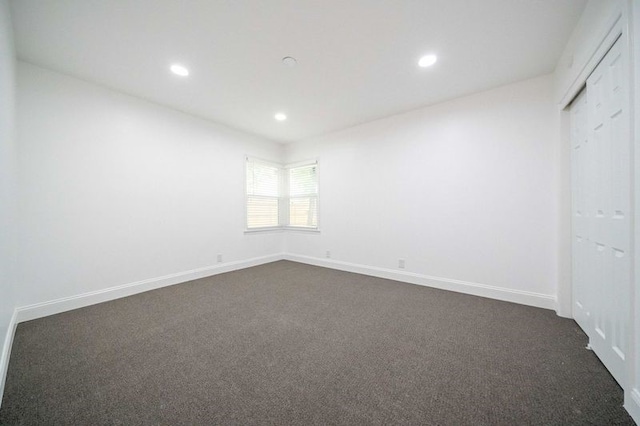 interior space featuring dark carpet