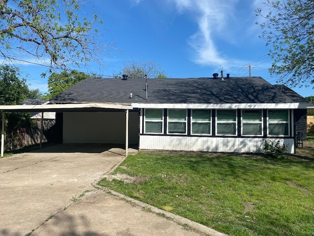 4944 Vega Ct W, Fort Worth, TX 76133 - view of front of property with a front lawn, concrete driveway, an attached carport, and a shingled roof
