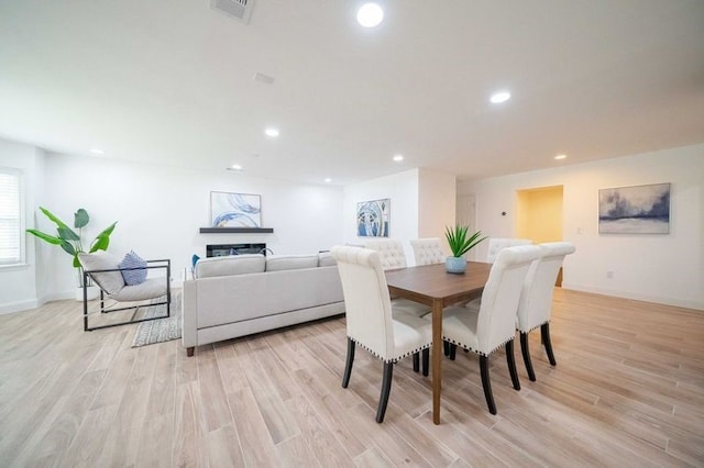 dining space featuring light hardwood / wood-style floors