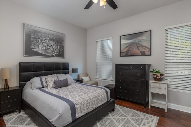 bedroom with ceiling fan and dark hardwood / wood-style flooring