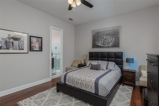 bedroom with connected bathroom, ceiling fan, and wood-type flooring