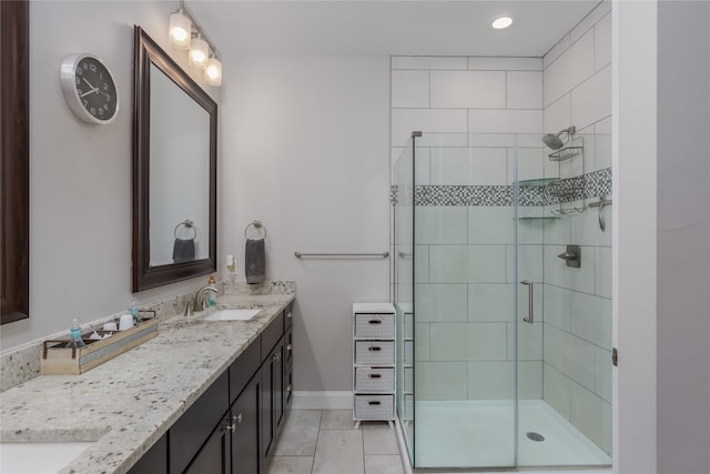 bathroom with vanity and a shower with shower door