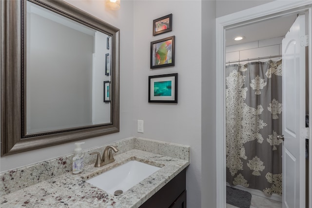 bathroom with a shower with curtain and vanity