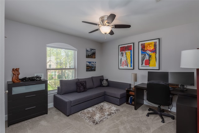 carpeted office with ceiling fan