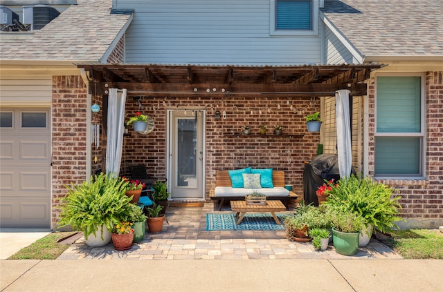 property entrance with a patio area and a garage