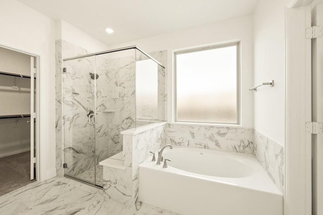 full bath with a walk in closet, marble finish floor, a marble finish shower, recessed lighting, and a bath