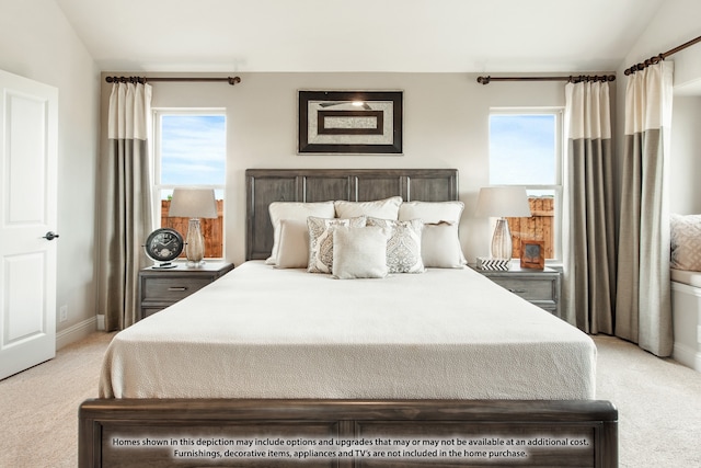 bedroom with vaulted ceiling, multiple windows, and carpet floors