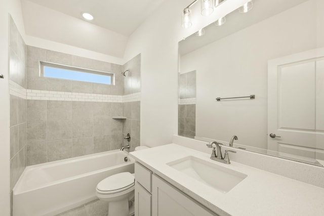 bathroom with toilet, vanity, and bathing tub / shower combination