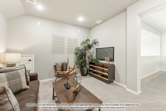 carpeted living room with vaulted ceiling