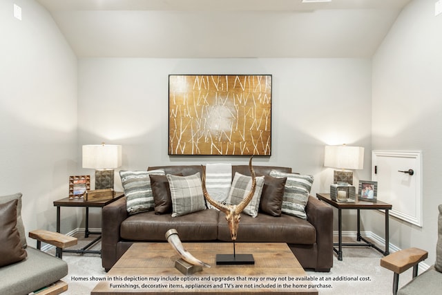 living room with lofted ceiling and light colored carpet