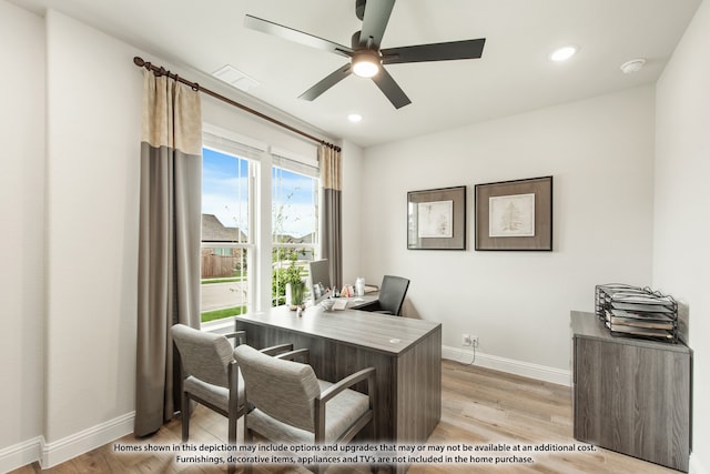 office space featuring light wood-type flooring and ceiling fan