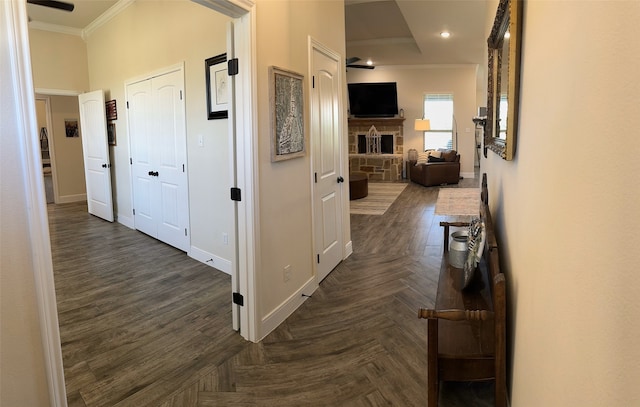 hallway featuring dark parquet floors and crown molding