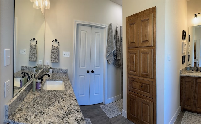 bathroom with vanity and hardwood / wood-style flooring