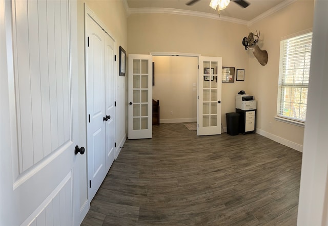 unfurnished room featuring french doors, crown molding, ceiling fan, and dark wood-type flooring