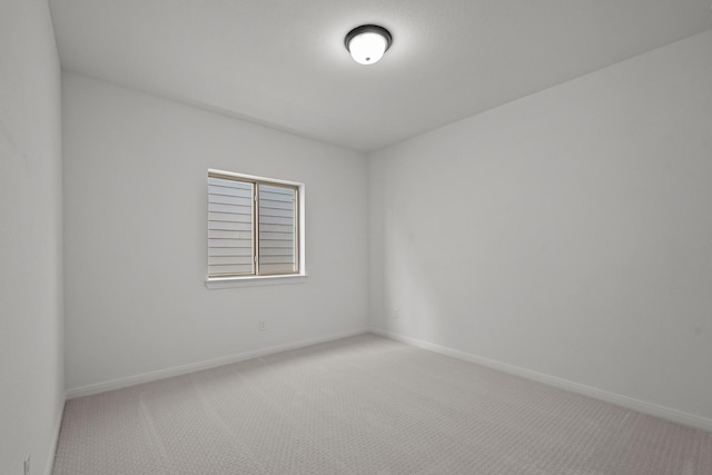 unfurnished room featuring carpet