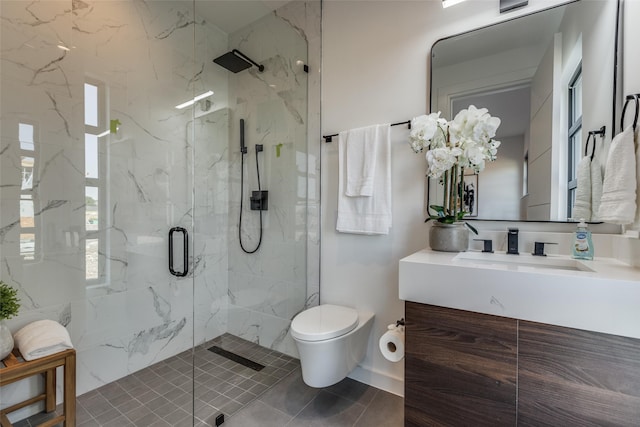 bathroom with vanity, toilet, and walk in shower