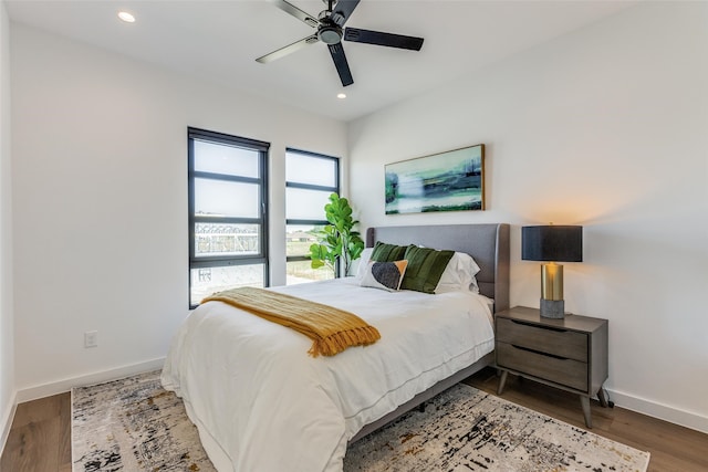 bedroom with hardwood / wood-style flooring and ceiling fan