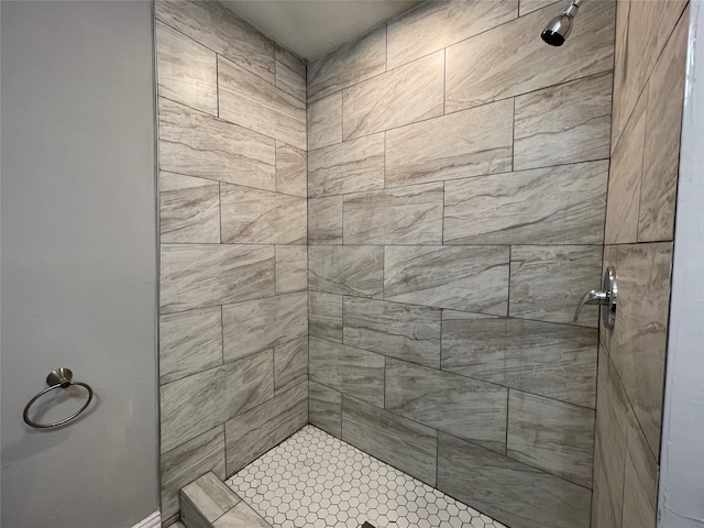 bathroom with a tile shower