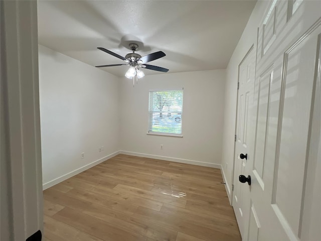 unfurnished bedroom with light wood-type flooring and ceiling fan