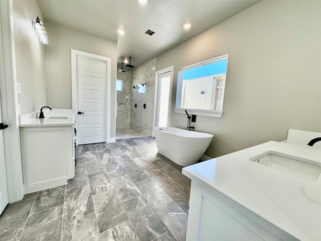 bathroom with vanity and plus walk in shower