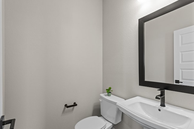 bathroom with a sink and toilet