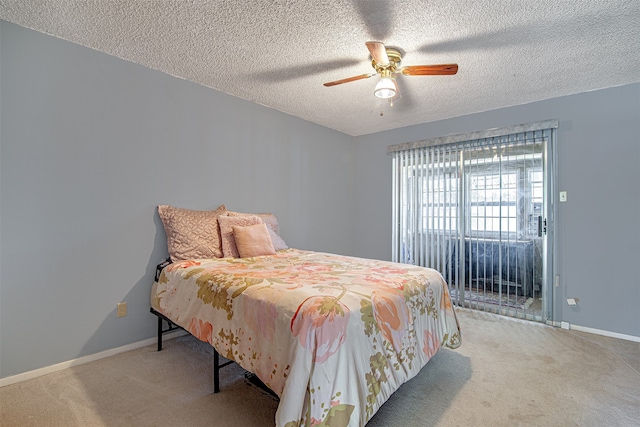 carpeted bedroom with ceiling fan, a textured ceiling, and access to outside