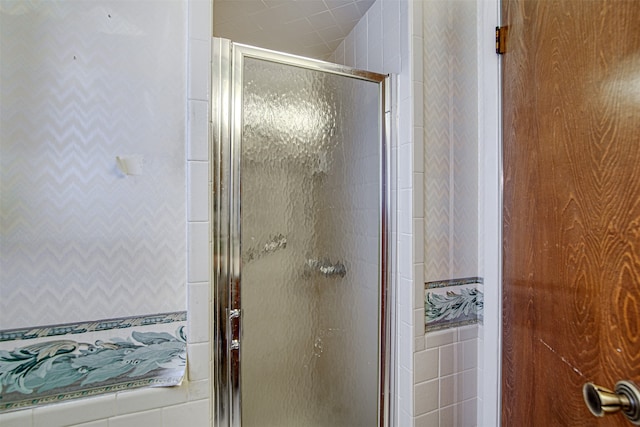 bathroom featuring an enclosed shower