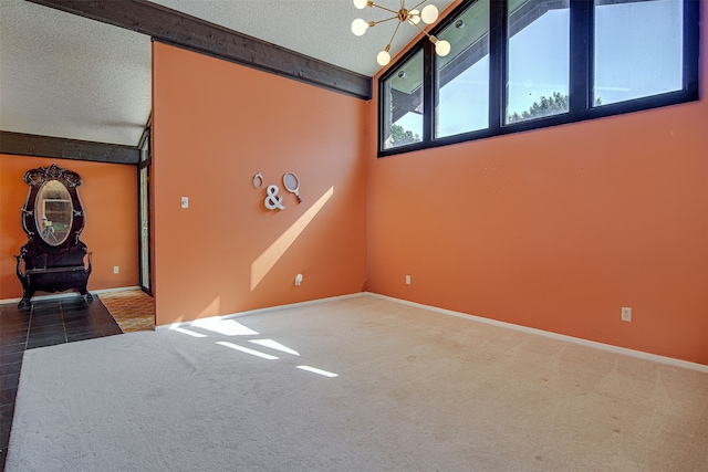 interior space featuring carpet flooring, a textured ceiling, lofted ceiling with beams, and a notable chandelier