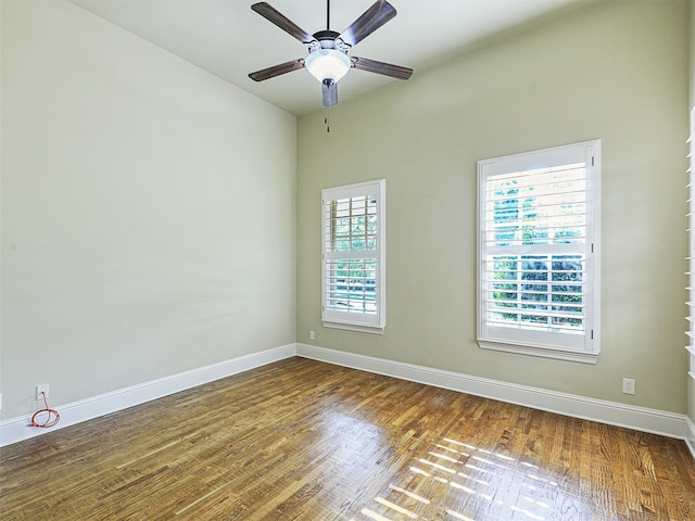 empty room featuring ceiling fan and dark hardwood / wood-style floors