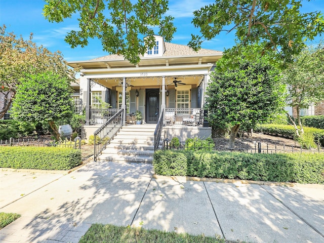 bungalow-style house with ceiling fan and covered porch