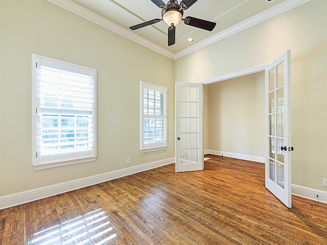 unfurnished bedroom featuring french doors, multiple windows, and ceiling fan