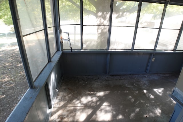 unfurnished sunroom with a wealth of natural light