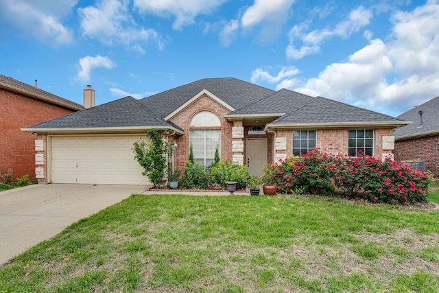 ranch-style home featuring a garage and a front lawn