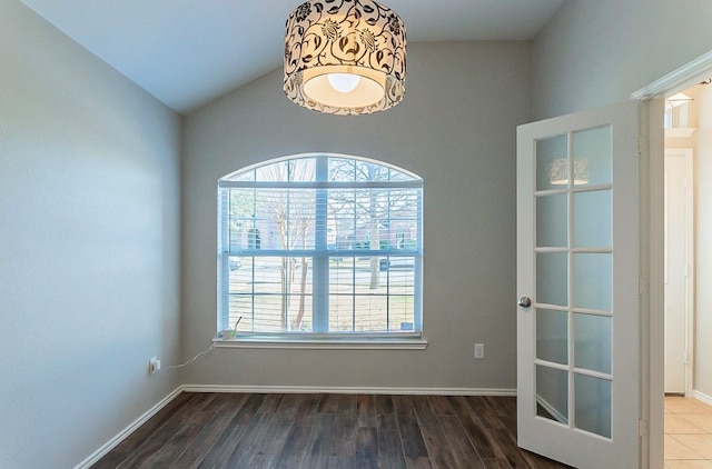 unfurnished room with dark hardwood / wood-style flooring