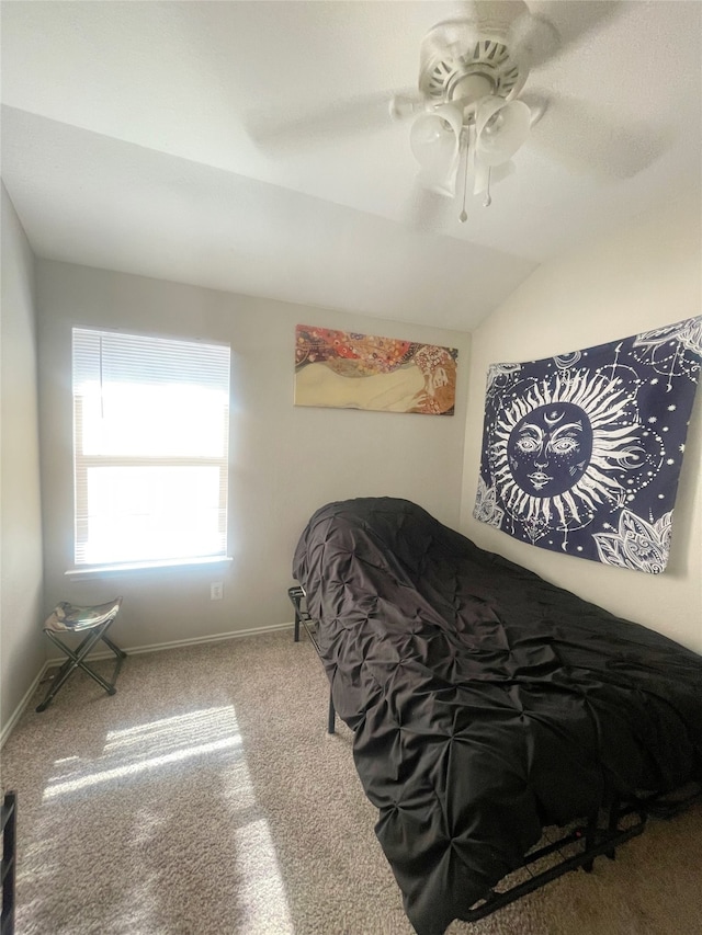 carpeted bedroom featuring vaulted ceiling and ceiling fan