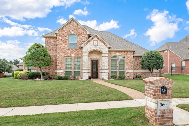 view of front of home with a front lawn