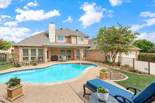 view of pool with a patio area, a jacuzzi, and a grill