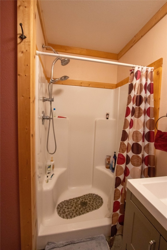 bathroom with vanity and a shower with shower curtain