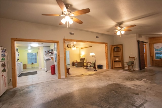 interior space with ceiling fan