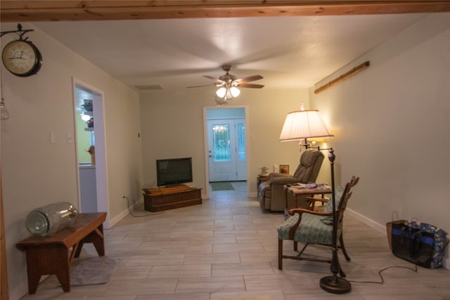 sitting room with ceiling fan and light hardwood / wood-style floors