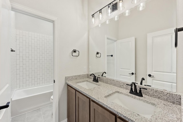 full bathroom with toilet, double vanity, a sink, and bathing tub / shower combination