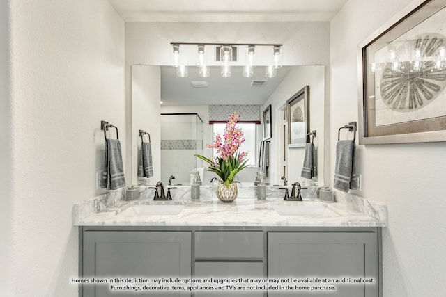 bathroom with walk in shower and vanity