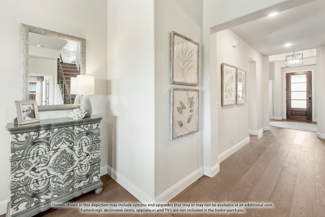 hallway with hardwood / wood-style flooring