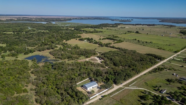 drone / aerial view featuring a water view and a rural view